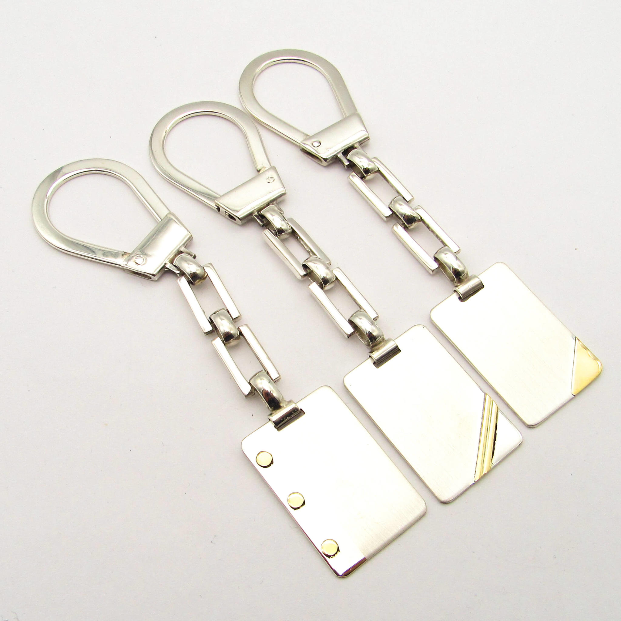 LLAVERO 23x35MM  /PLATA Y ORO